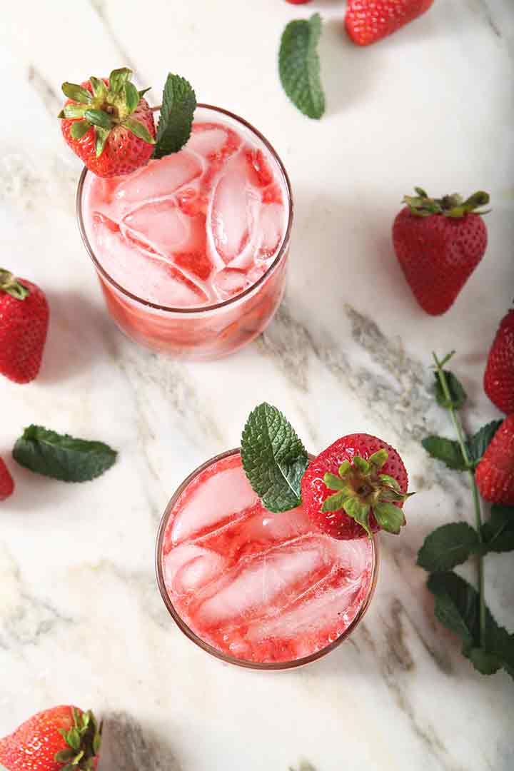 Overhead image of two Strawberry Mules, garnished and ready for drinking