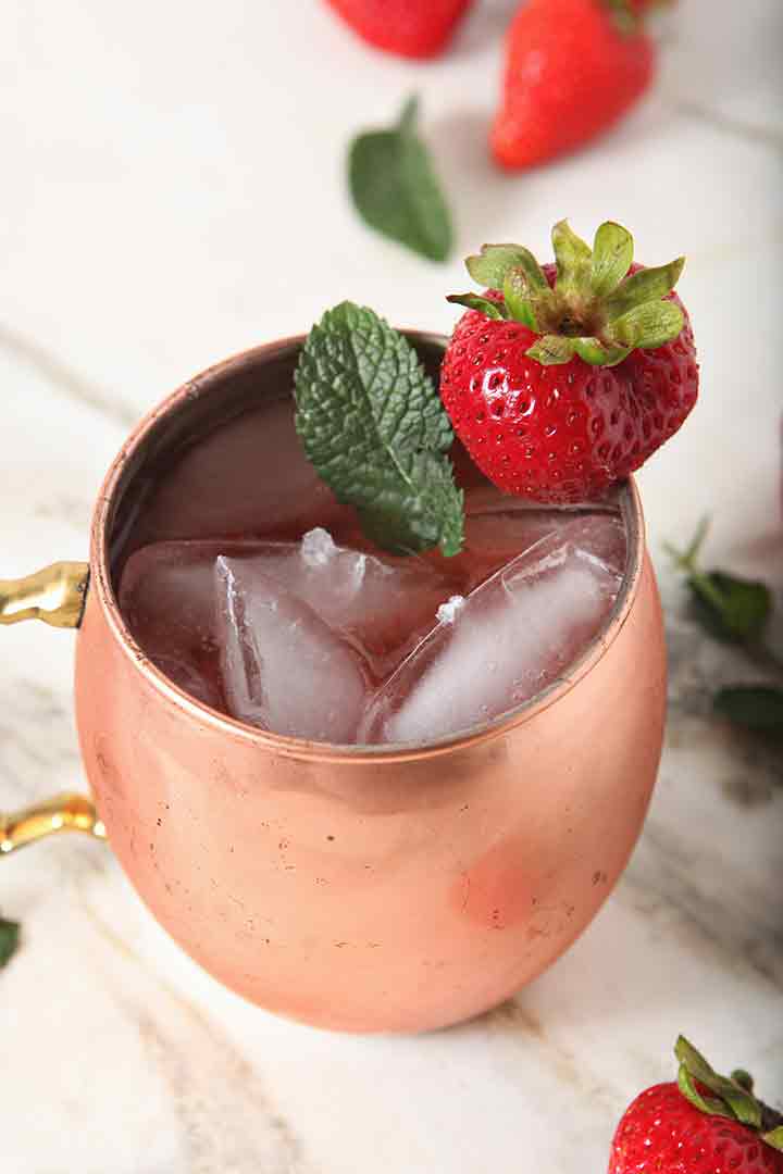 Close up of a Strawberry Moscow Mule in a copper mug