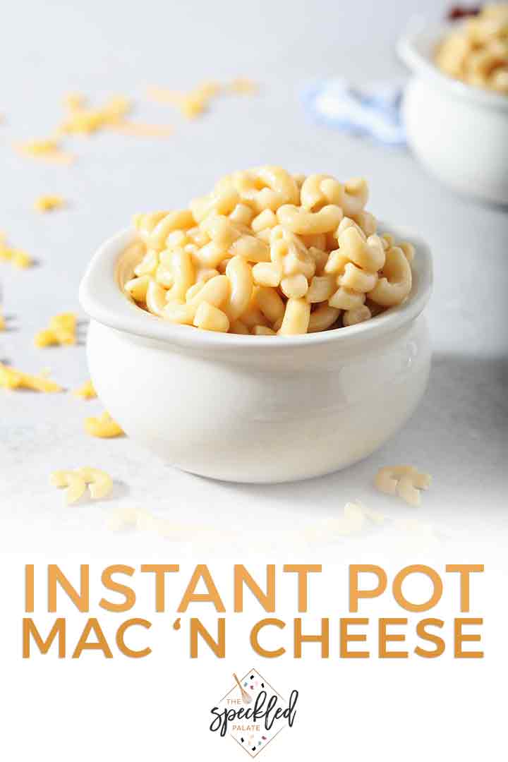 A close up of a bowl of Instant Pot Macaroni and Cheese is shown with Pinterest text