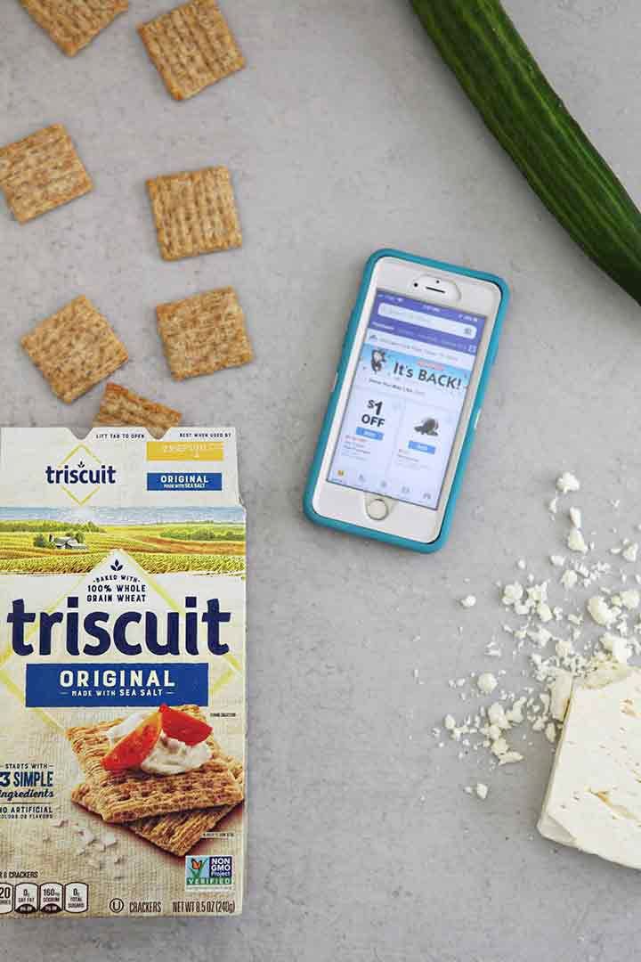 triscuits and an iphone on a grey surface