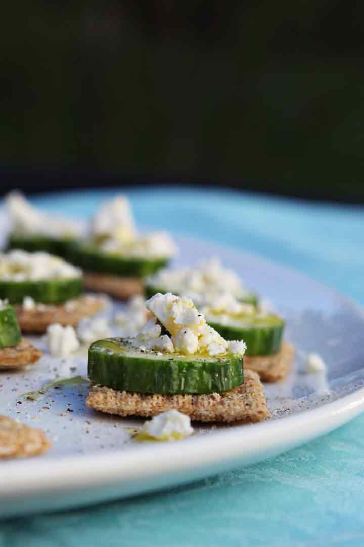 Close up of the cucumber appetizer on a white platter outdoors