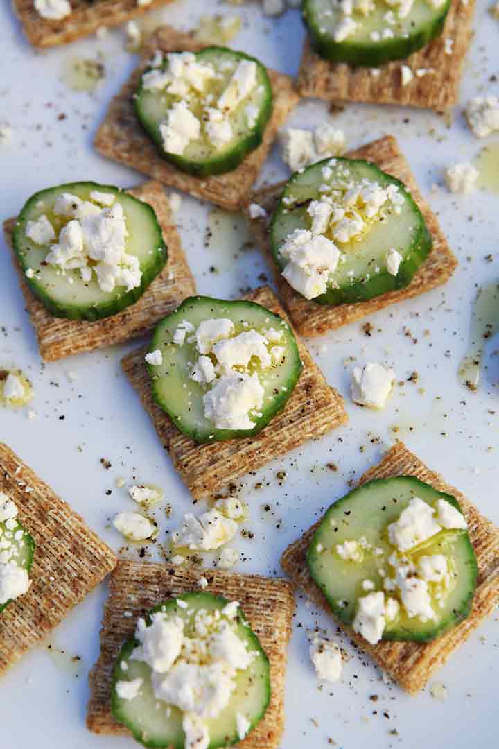 A close up of TRISCUIT Cucumber Appetizer from above on a white platter