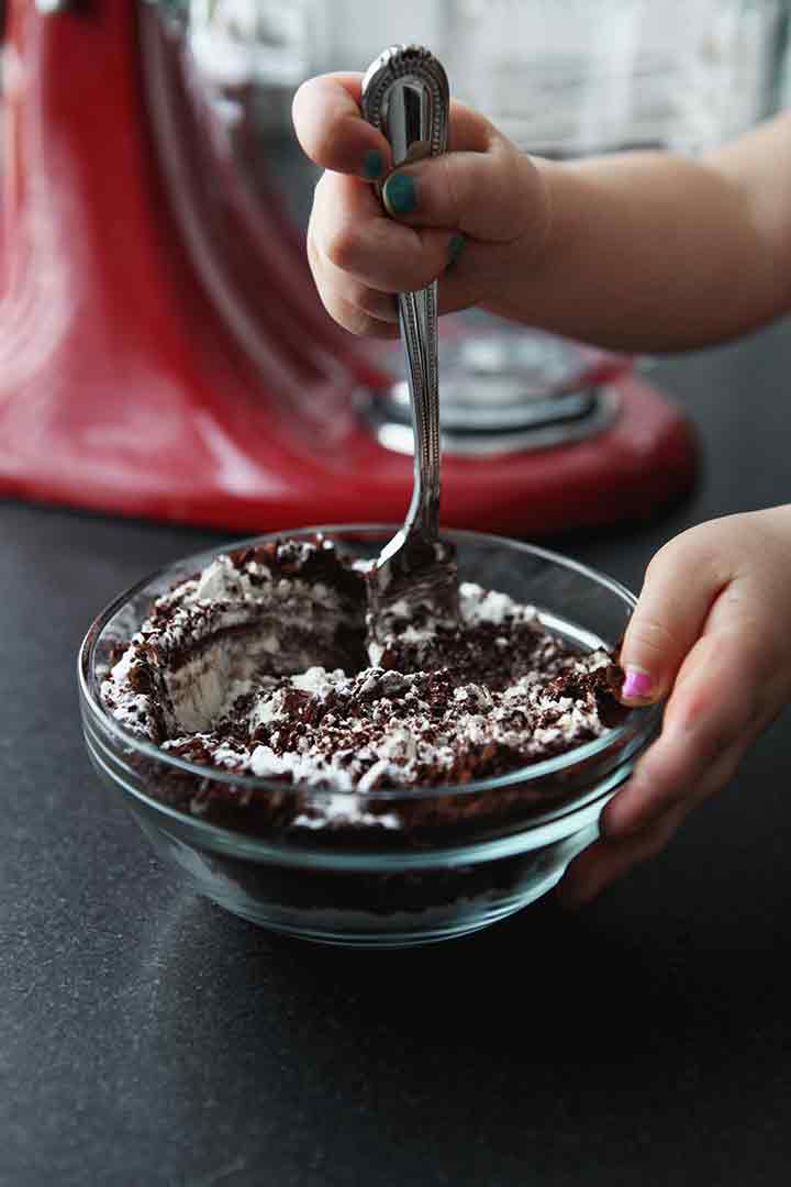 Close up of a girl stirring dry ingredients together for a cake