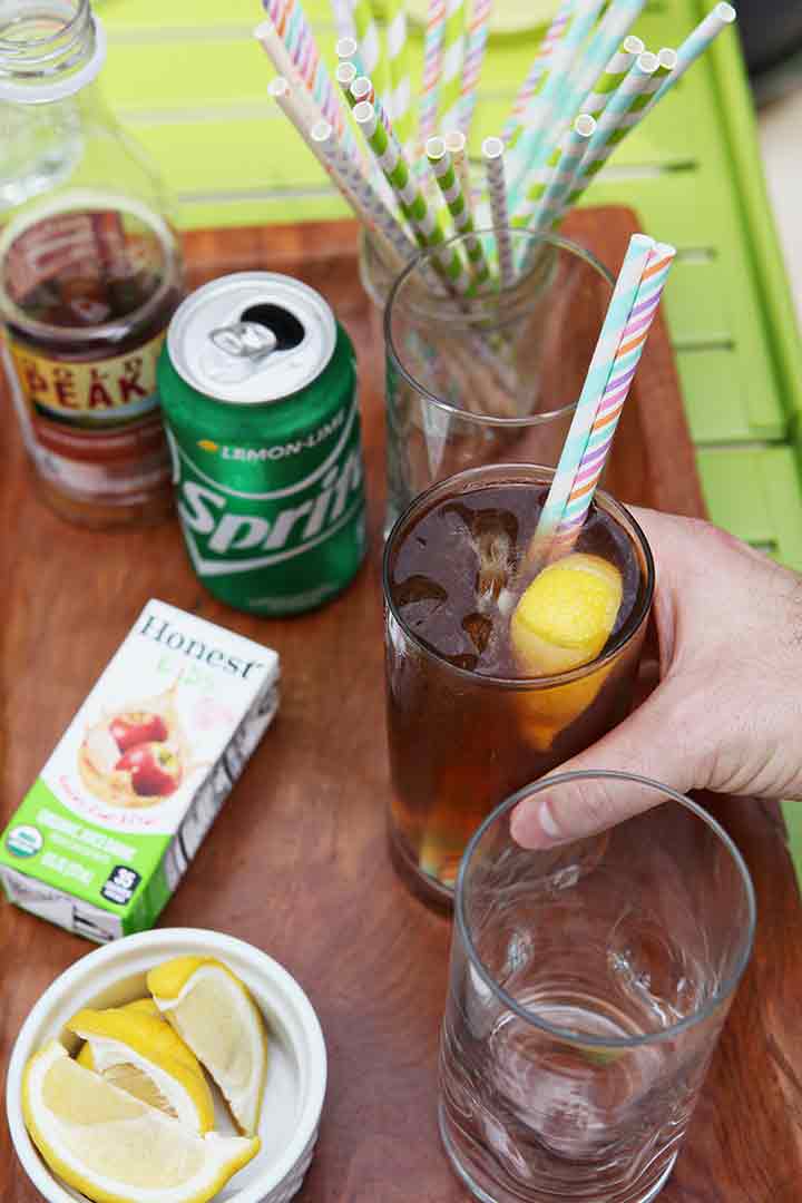 A man grabs an Arnold Palmer off an Outdoor Drink Station