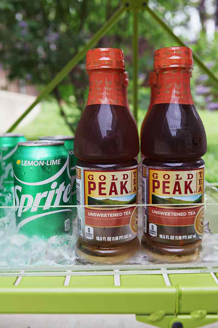 Close up of Gold Peak Unsweetened Teas and Sprite on a bar cart