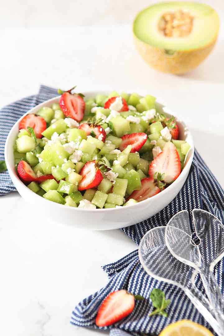 The ingredients for the dish are shown in a bowl, before the balsamic drizzle