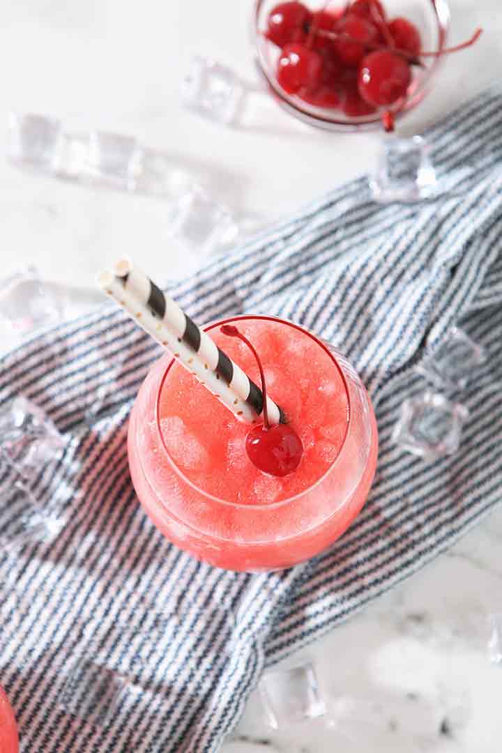 A Cherry Bourbon Slush from above, on a blue towel