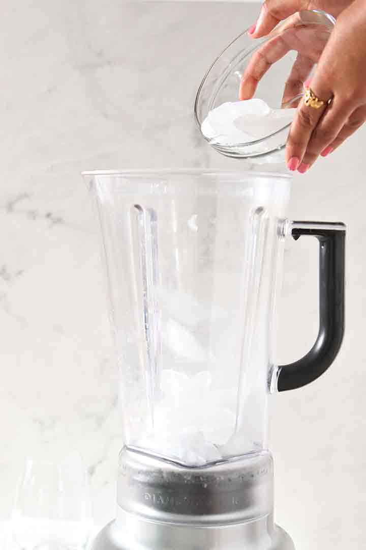 Ice is poured into a blender before the drink is made