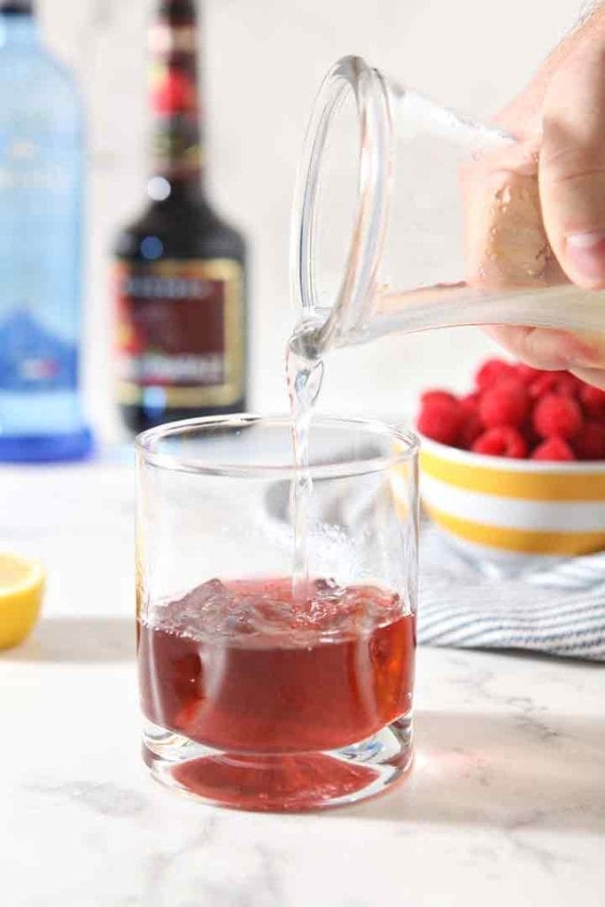 Lemonade pours into the glass