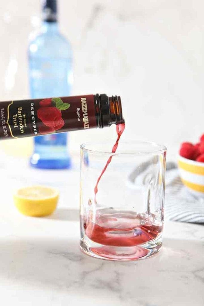 DeKuyper® Razzmatazz® Liqueur pours into a glass