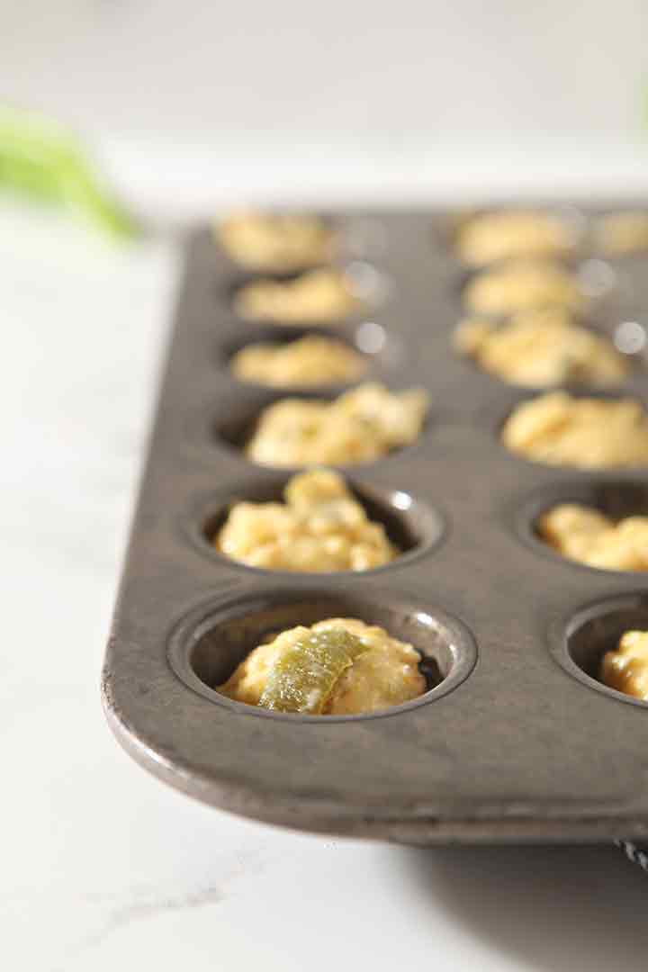 Close up of muffin batter in the tins, before baking