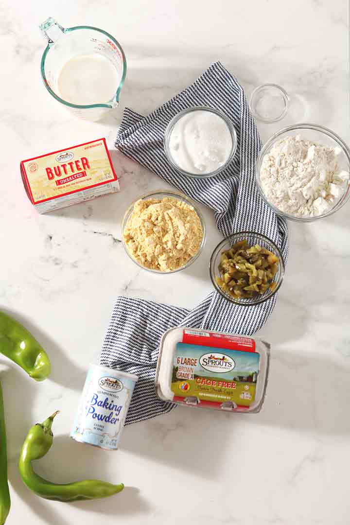 Ingredients for the muffins are laid out on a marble surface