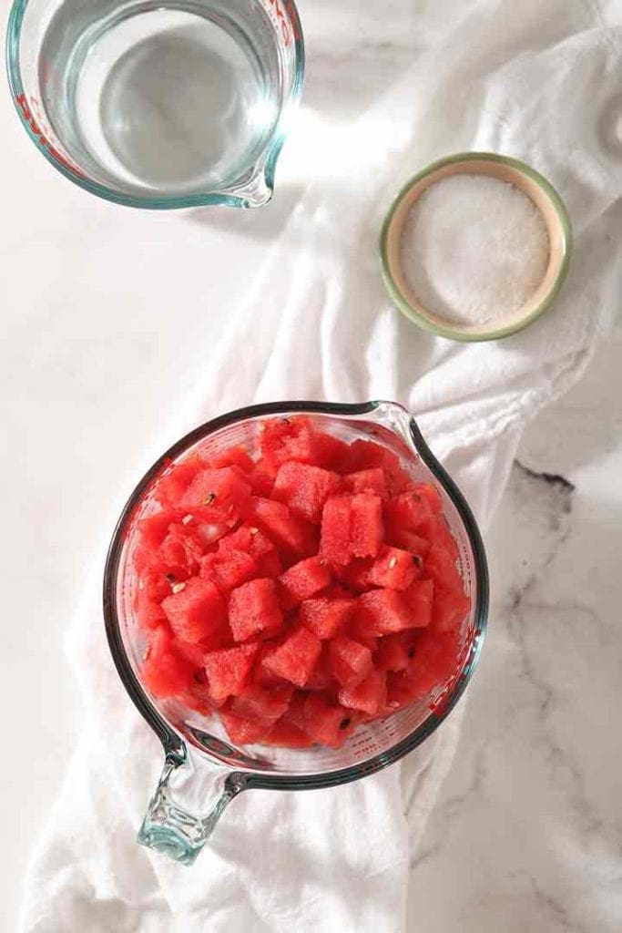 Ingredients for the recipe are laid out on a marble surface