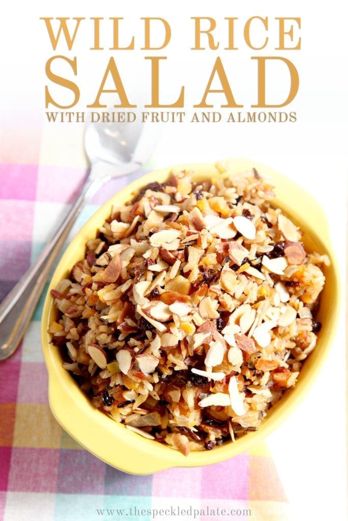 Wild Rice Salad with Dried Fruit and Almonds from above in a serving dish, with Pinterest text