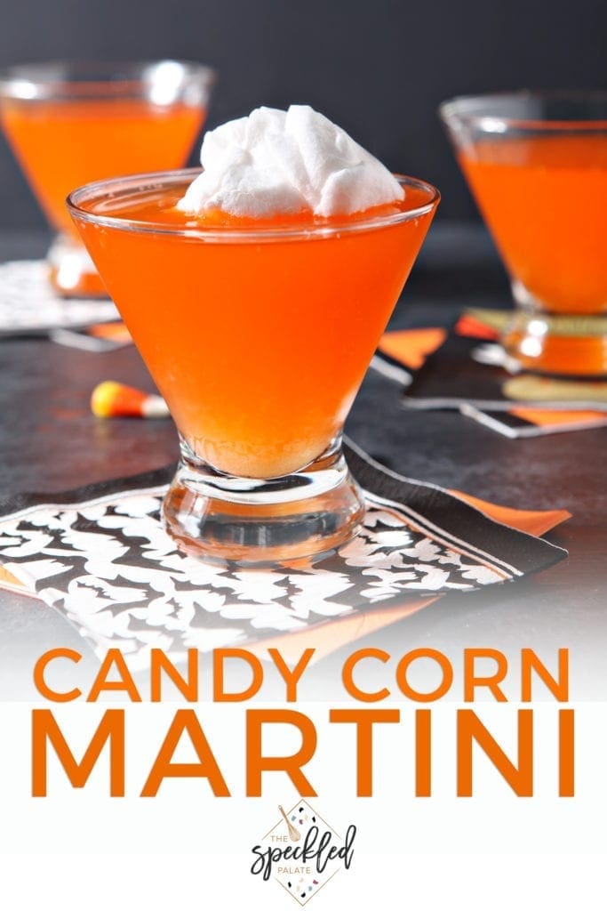 Close up of a Candy Corn Martini, with cotton candy on top