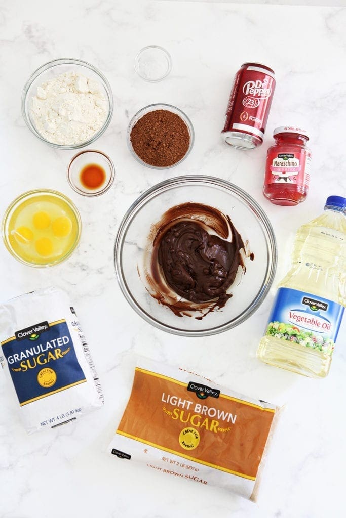 Ingredients for the brownies are laid out on a marble background