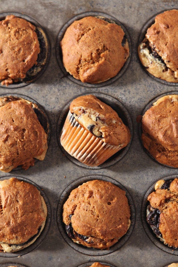 Easy Pumpkin Muffins, shown in the muffin tin, cool before they are enjoyed