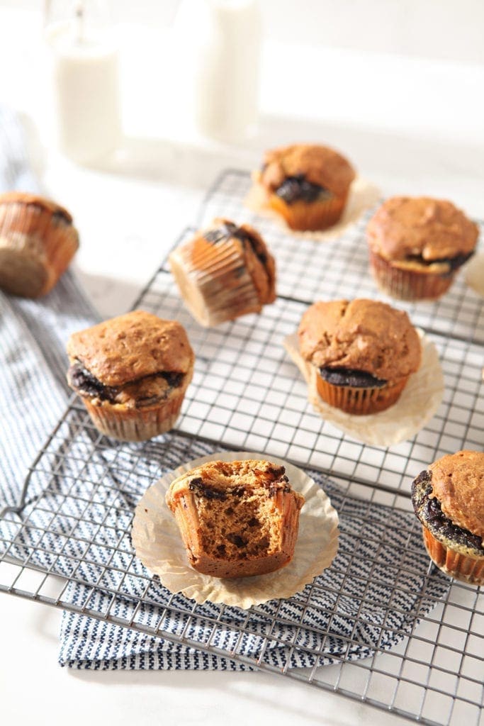 Several Easy Pumpkin Muffins with Cream Cheese and Nutella Swirl cool on a wire cooling rack