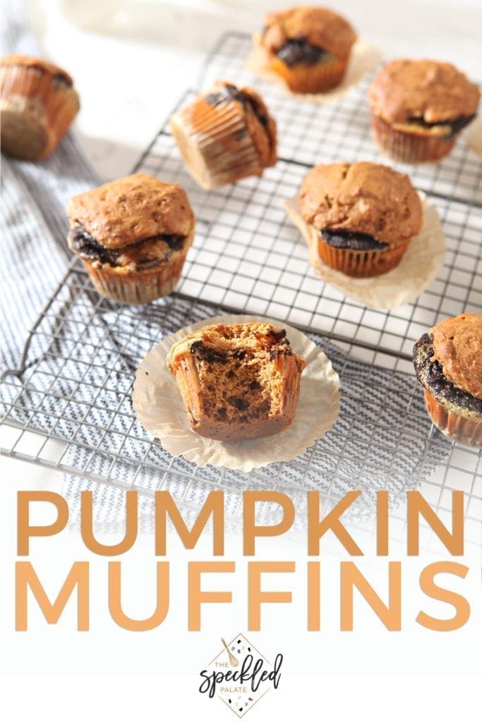 Several Easy Pumpkin Muffins cool on a wire cooling rack, with Pinterest text