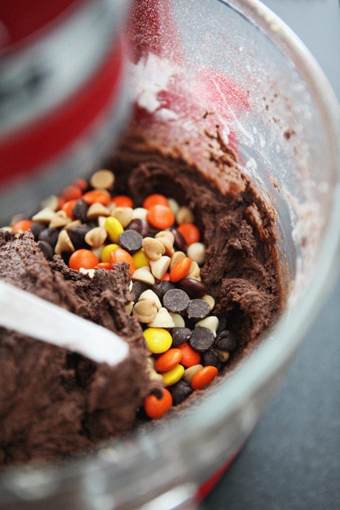 Chocolate chips, white chocolate chips, peanut butter chips and Reese's Pieces are mixed into the batter, in the stand mixer