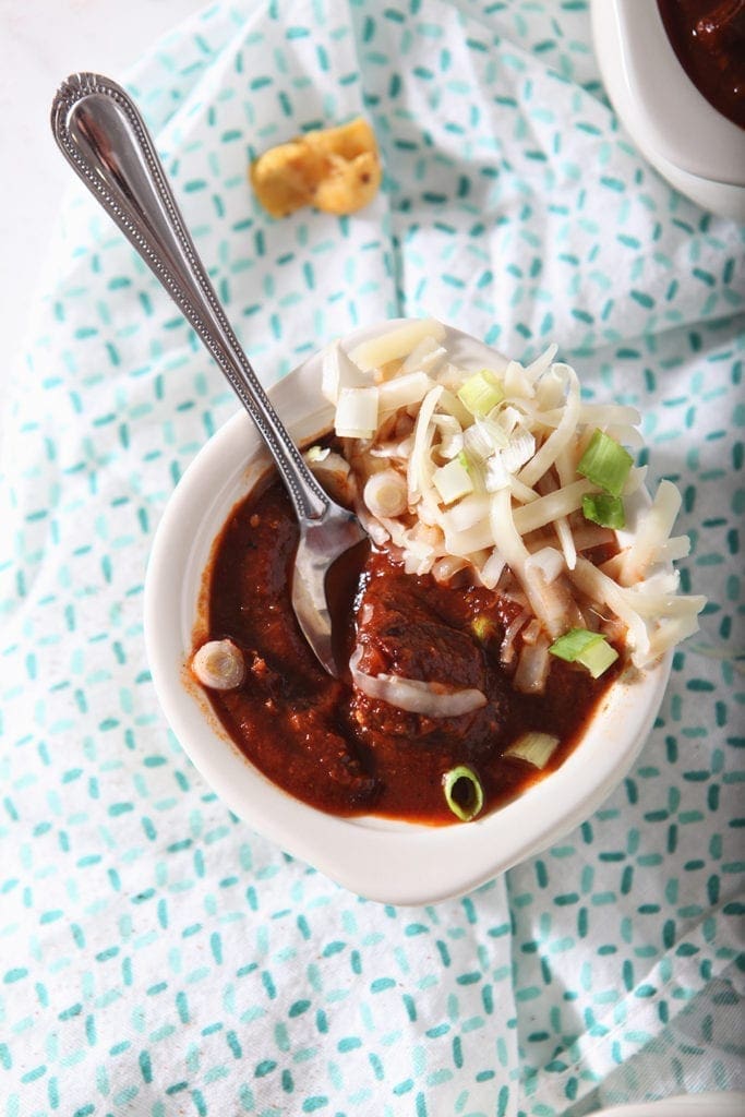 Homemade Texas Chili from above, garnished with cheese and green onions