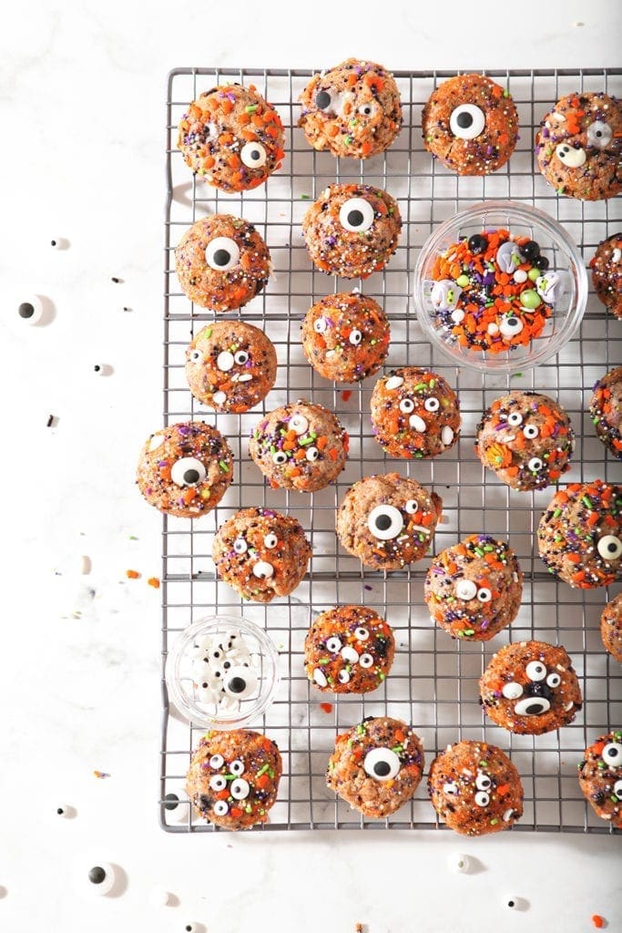 Cookies on a cooling rack, with extra sprinkles