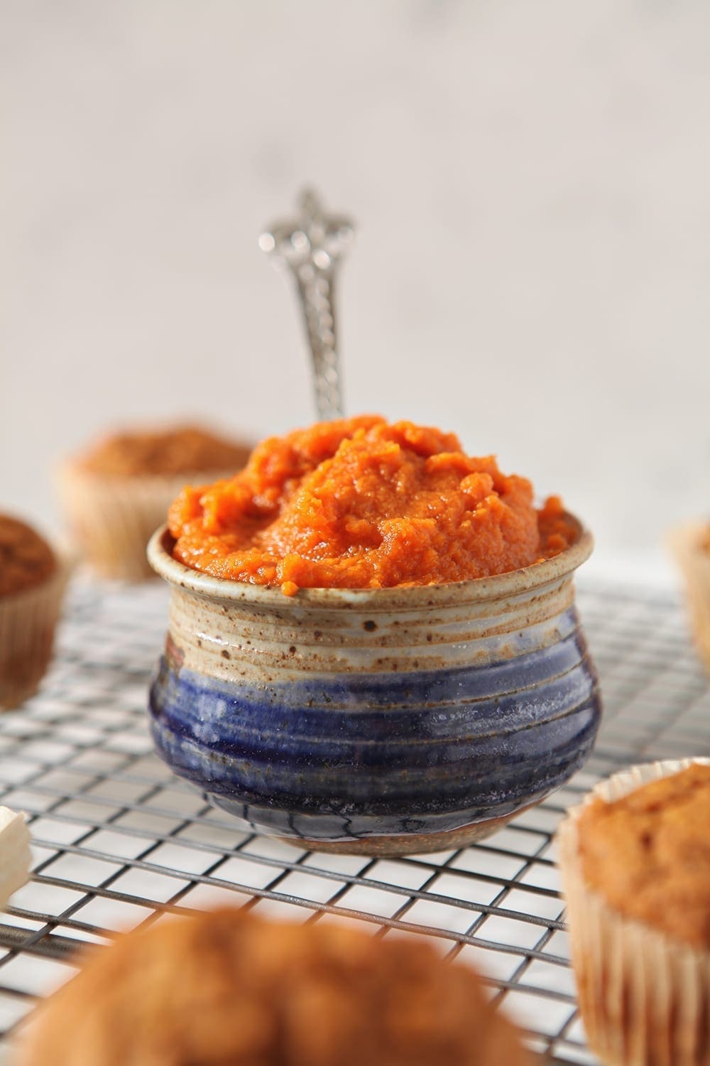 Pumpkin puree in a bowl, with a spoon