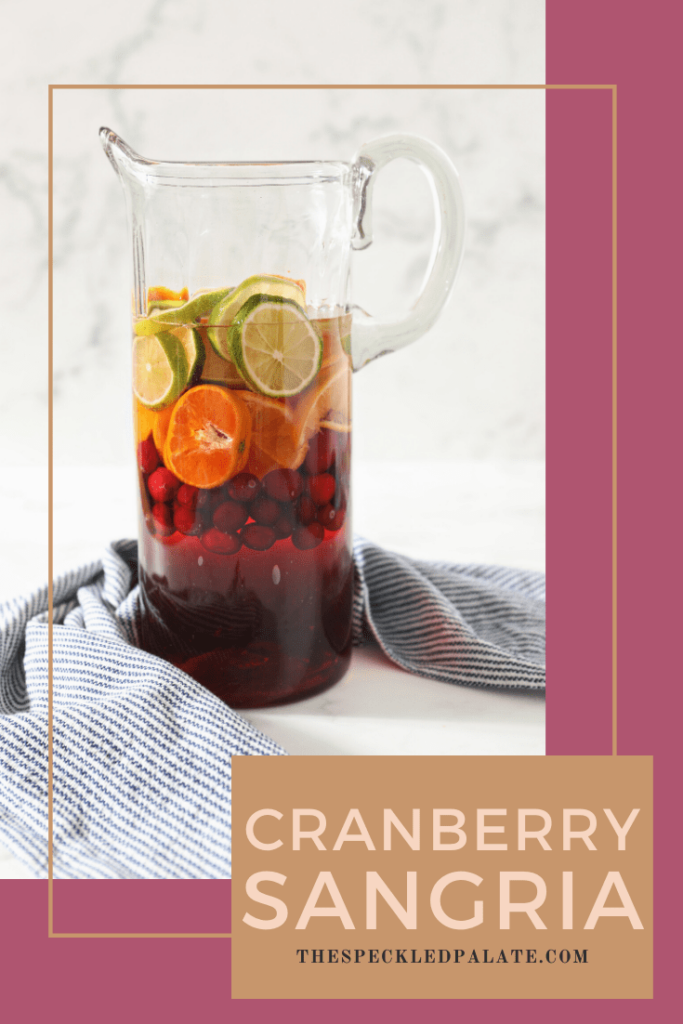 Pinterest image for Citrus Cranberry Sangria, showing a pitcher full of the sangria and text