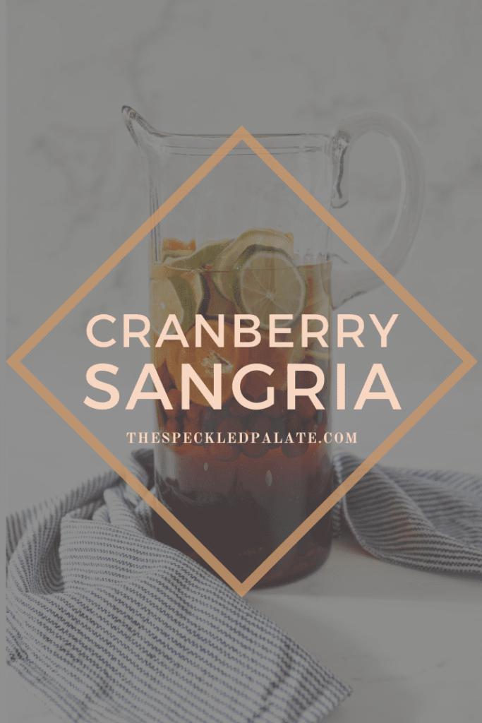 Pinterest image for Citrus Cranberry Sangria, including a text overlay over the pitcher