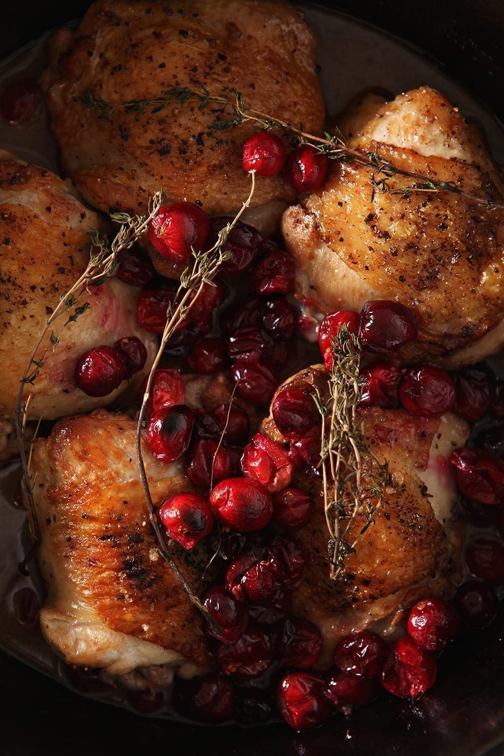 Close up of the Cranberry Chicken Thighs in the skillet, after baking