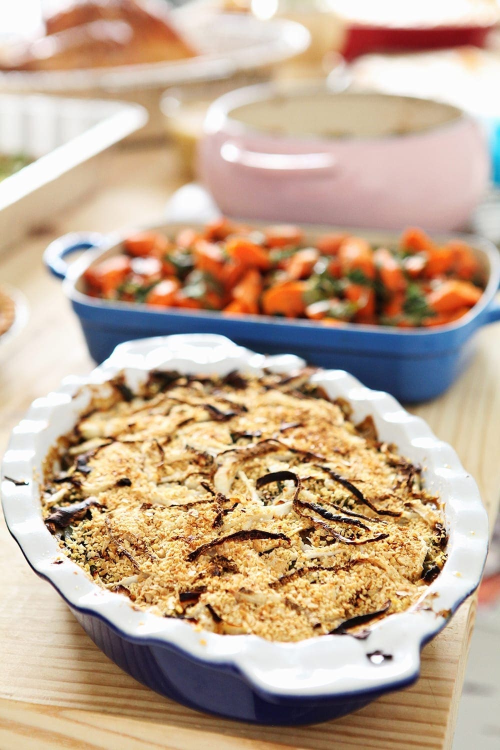 Fresh Green Bean Casserole on a table with other Friendsgiving foods