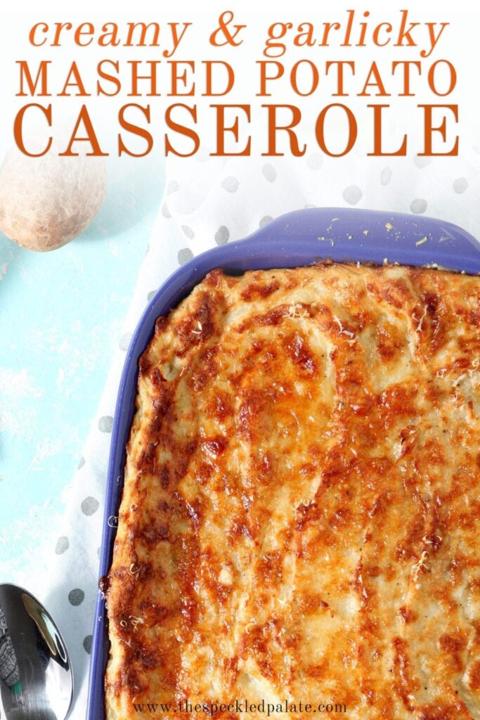 Close up of a purple dish holding Garlic Parmesan Mashed Potato Casserole after baking, with Pinterest text