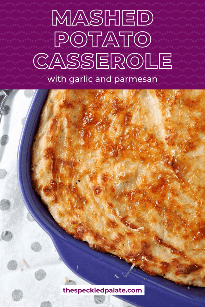 a purple casserole dish holding a baked potato casserole with the text mashed potato casserole with garlic and parmesan