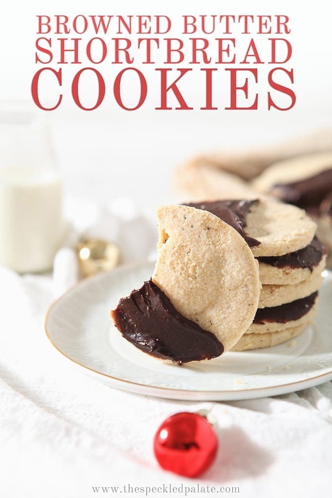 A bitten into Shortbread Brown Butter Cookies sits on a white plate, with Pinterest text