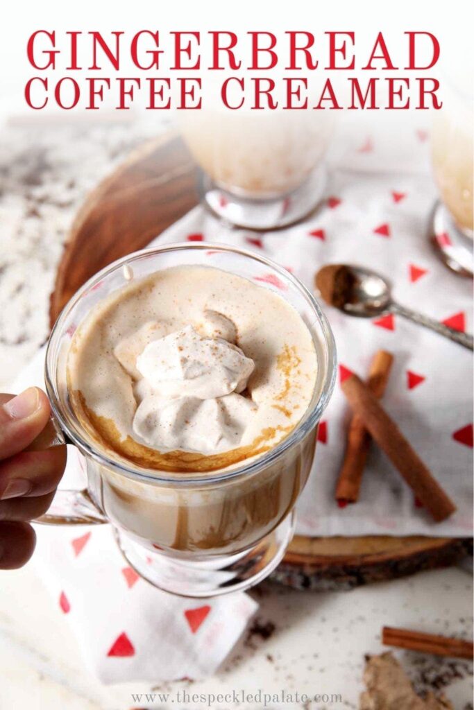 A woman holds a mug of coffee with Homemade Gingerbread Coffee Creamer, with Pinterest text