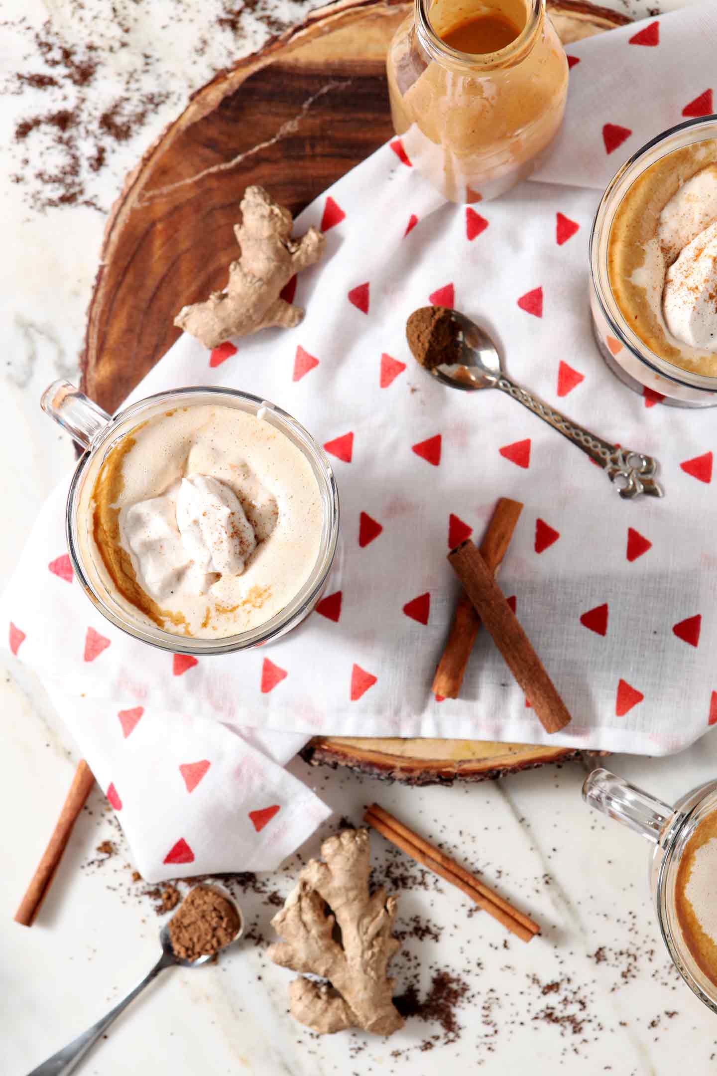 holiday coffee with cinnamon sticks and a silver spoon