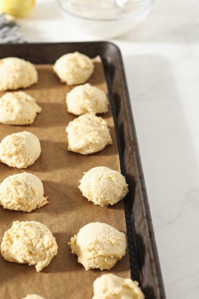 Lemon Drop Cookies on a baking sheet, after baking