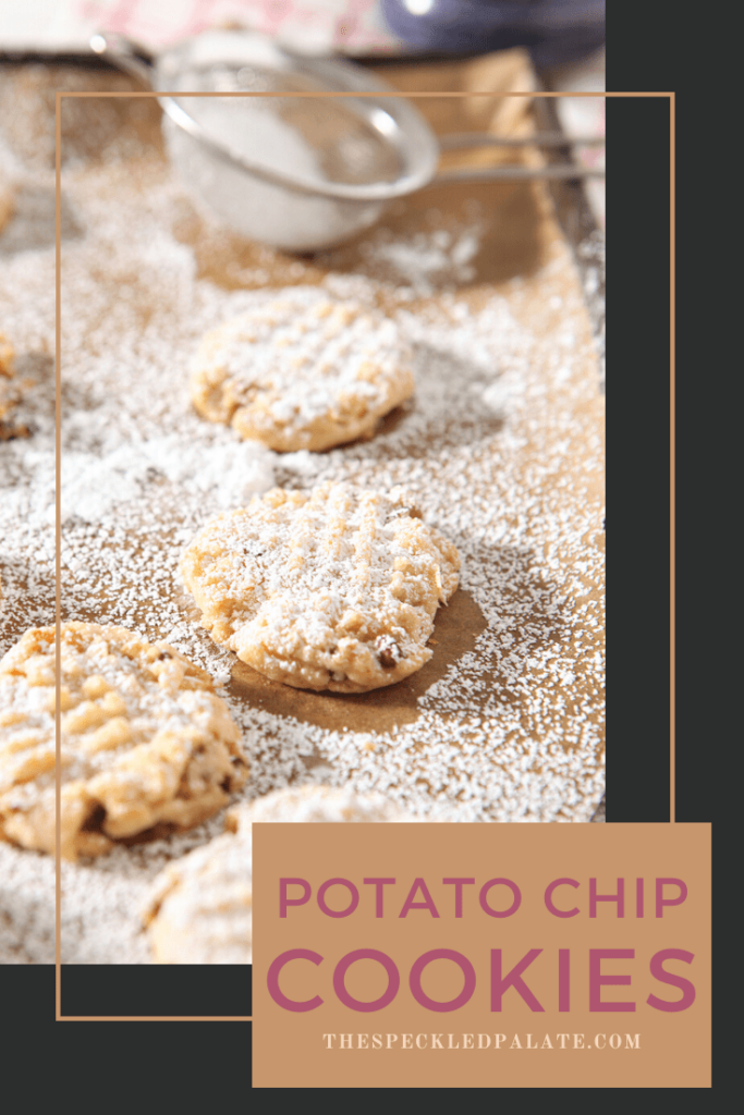 Potato Chip Cookies on a baking sheet after being sprinkled with powdered sugar, with Pinterest text