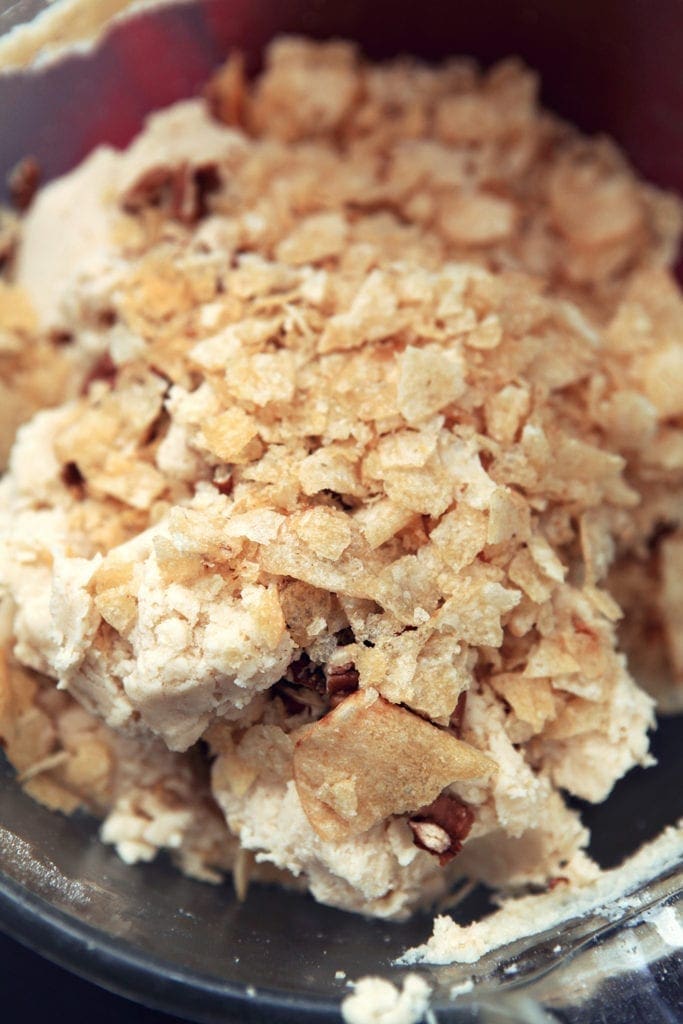 Potato chips are sprinkled on top of cookie dough before mixing in