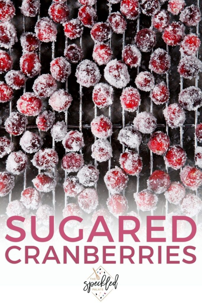 Sugar coated cranberries on a wire rack with the text sugared cranberries