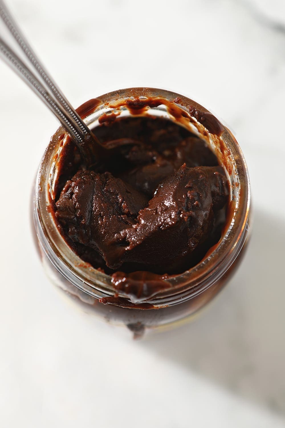 Dark roux inside of a jar, from above