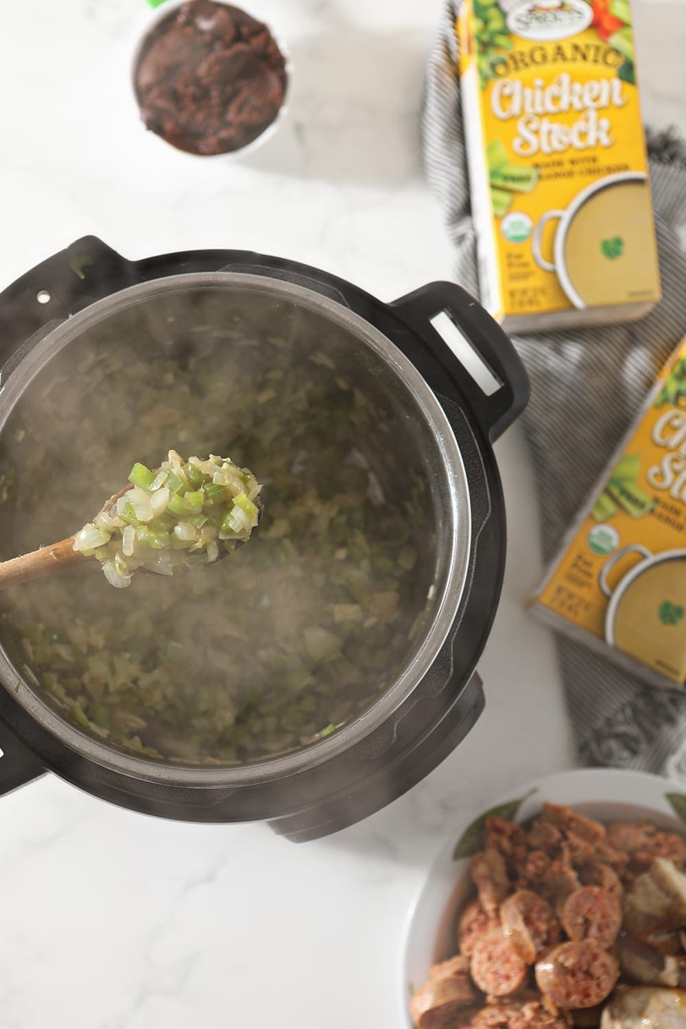 Veggies saute in the Instant Pot before the rest of the ingredients are stirred in, from above