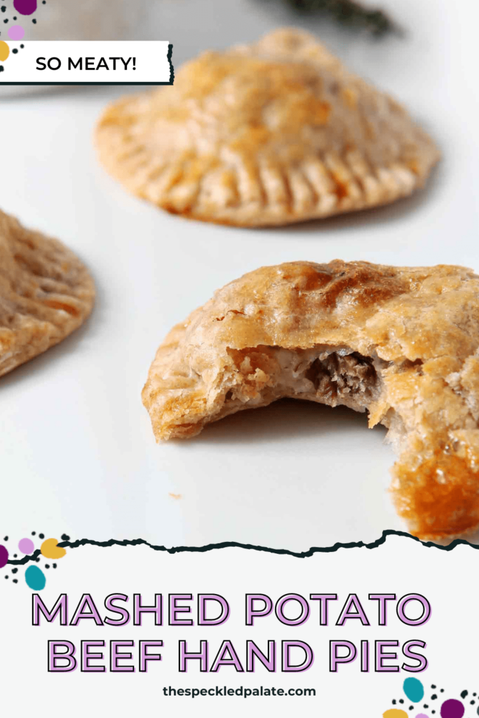 A bitten-into round hand pie with other hand pies on a white plate with the text Mashed Potato Beef Hand Pies