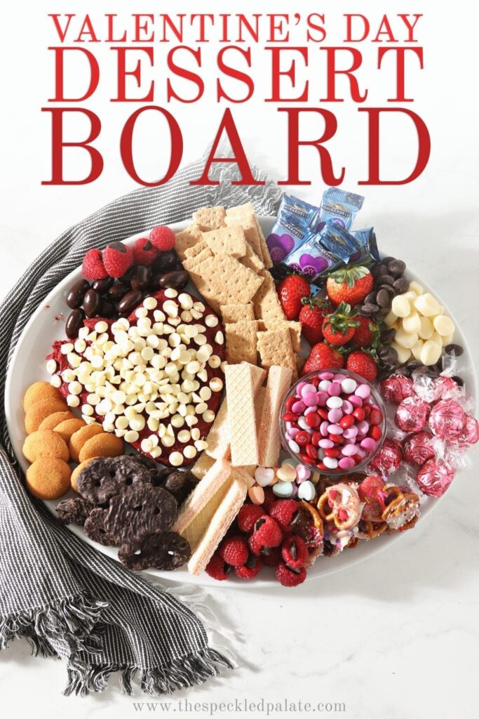 A white platter holds a dessert board, shown from above with Pinterest text