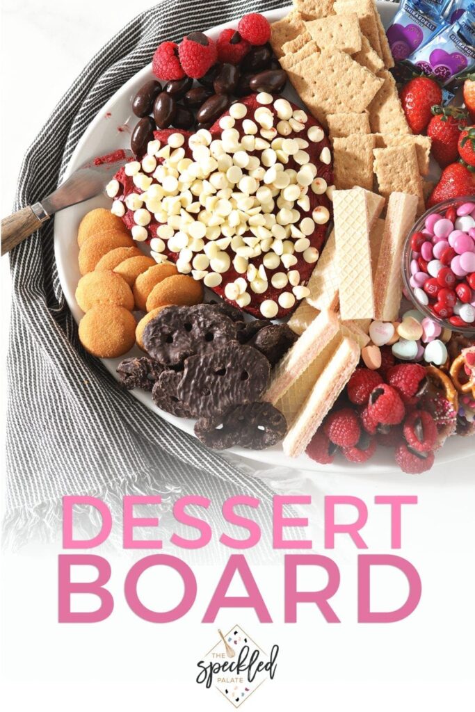 Close up of a Valentine's Day Dessert Board, with Pinterest text