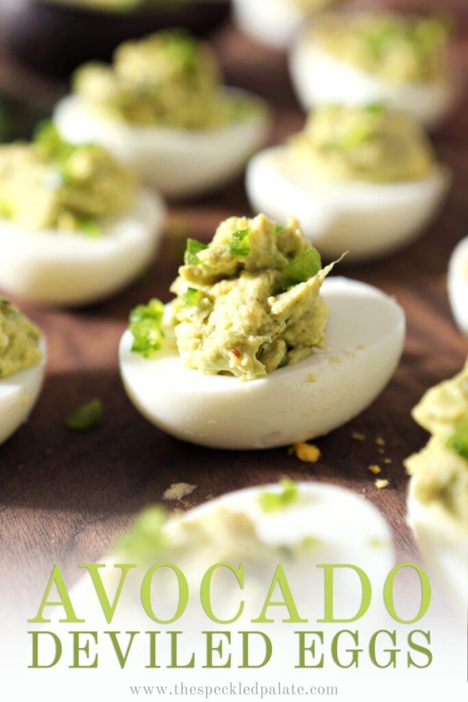 Close up of an Avocado Deviled egg, with Pinterest text