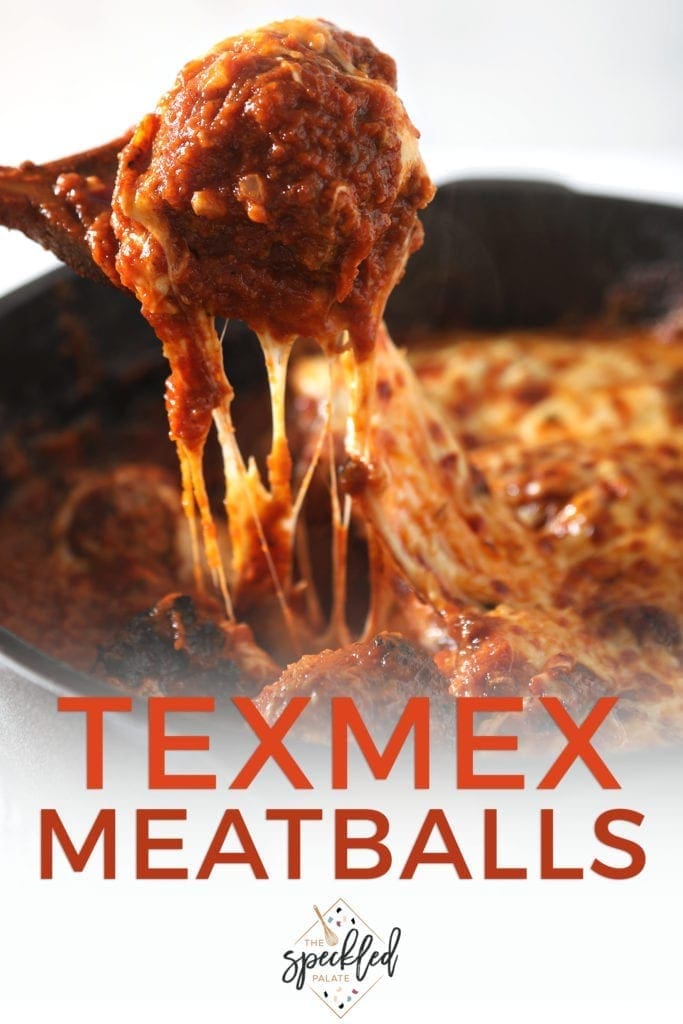 A spoon pulls a cheesy meatball from the pan, with Pinterest text
