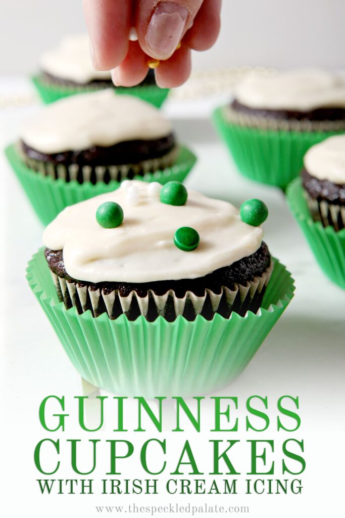 Close up of a Guinness Cupcake with sprinkles being added and Pinterest text