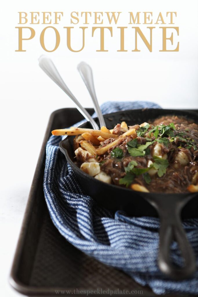 A skillet holds Canadian poutine, with Pinterest text