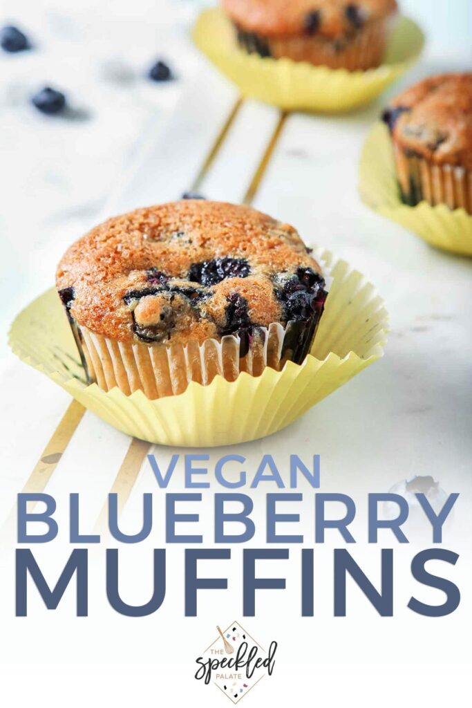 Close up of a Vegan Blueberry Muffin on a marble platter, with Pinterest text